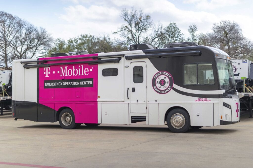 Large motorhome style RV parked outdoors. Vehicle is branded with the mobile365 logo and the title of Emergency Operation Center